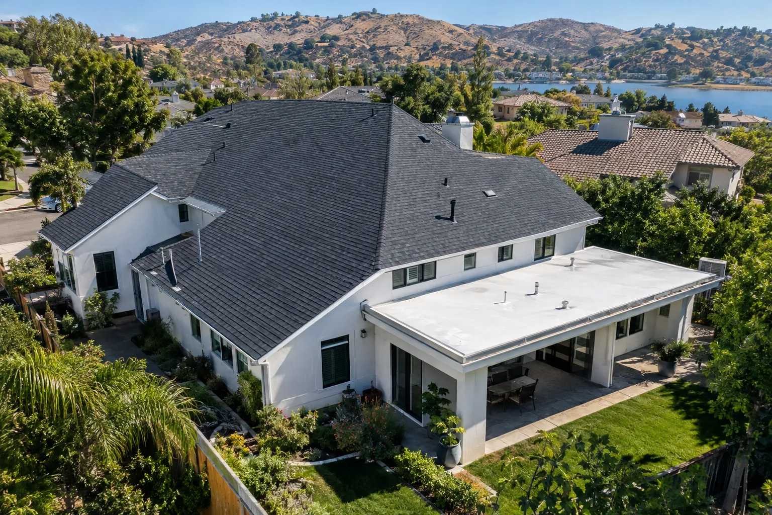 Aerial view of shingle and low-slope roofing on a Westlake Village, California home