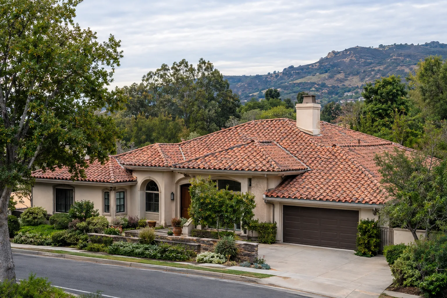 Clay tile roof replacement with valleys and chimney flashing in Agoura Hills, California